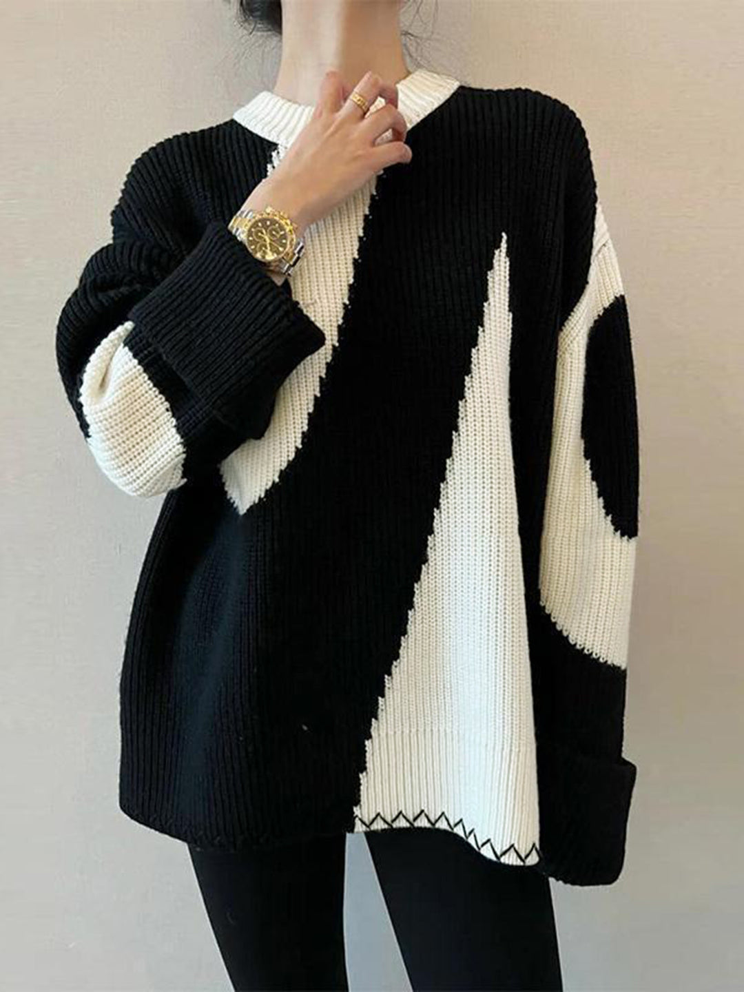 Chic women's oversized zebra print sweater with a round neck. Perfect for comfortable casual fashion wear.