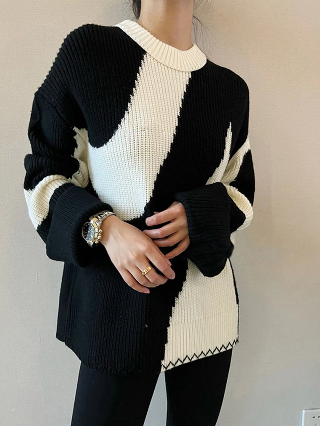Model wearing a comfortable oversized zebra print sweater, a fashionable long-sleeve statement piece for women.