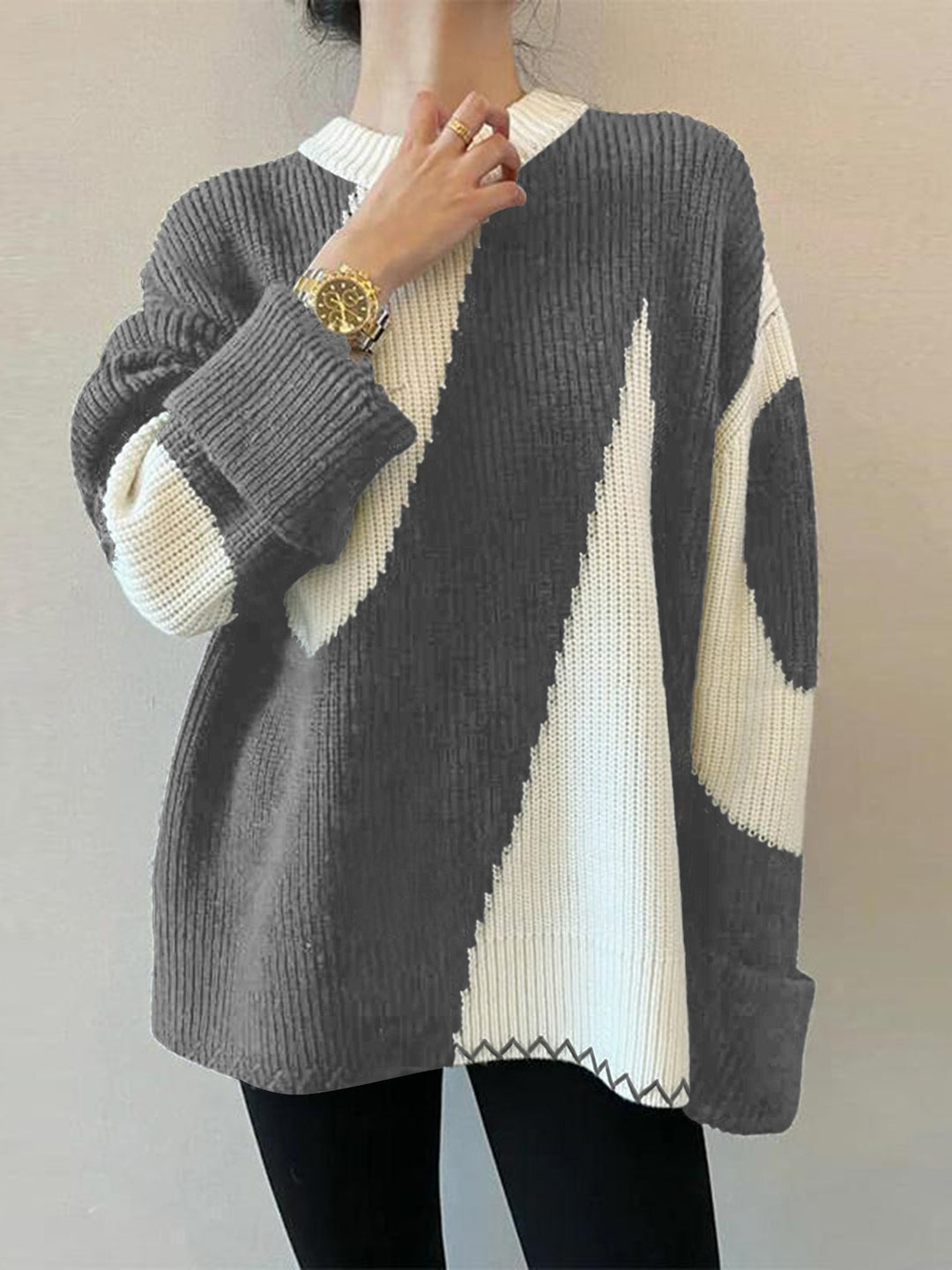 Fashionable women's oversized zebra print round neck sweater. A stylish, comfortable long-sleeve top.