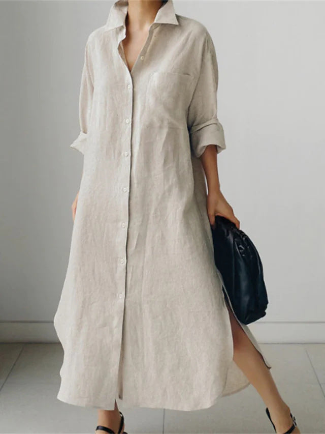 Longline women's midi shirt dress with roll sleeves, button-down front, and essential pockets. Relaxed, chic casual style.