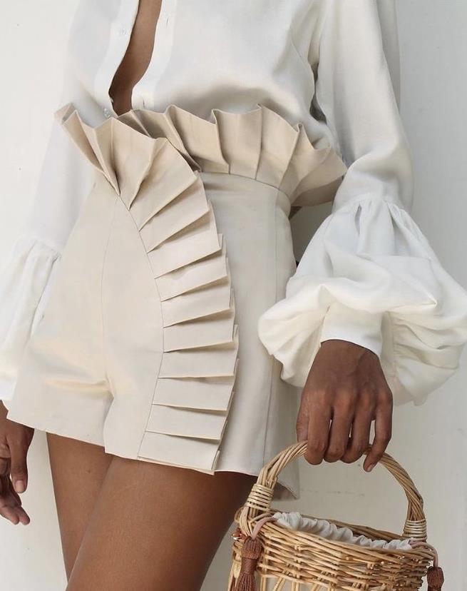 Chic women's ruffle shorts with a stylish flared hem, perfect for summer casual wear.
