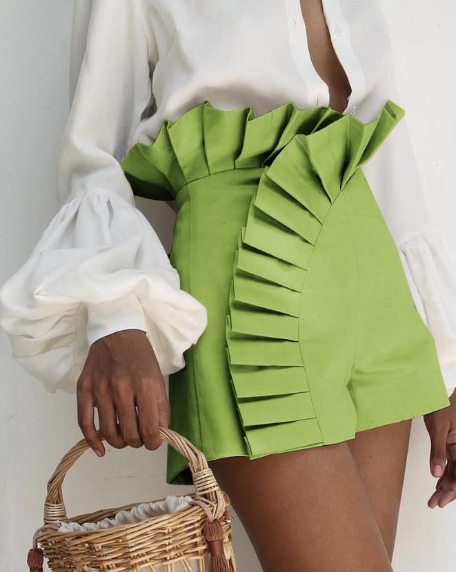 Fashionable women's ruffle shorts with a comfortable flared hem, essential for chic summer apparel.