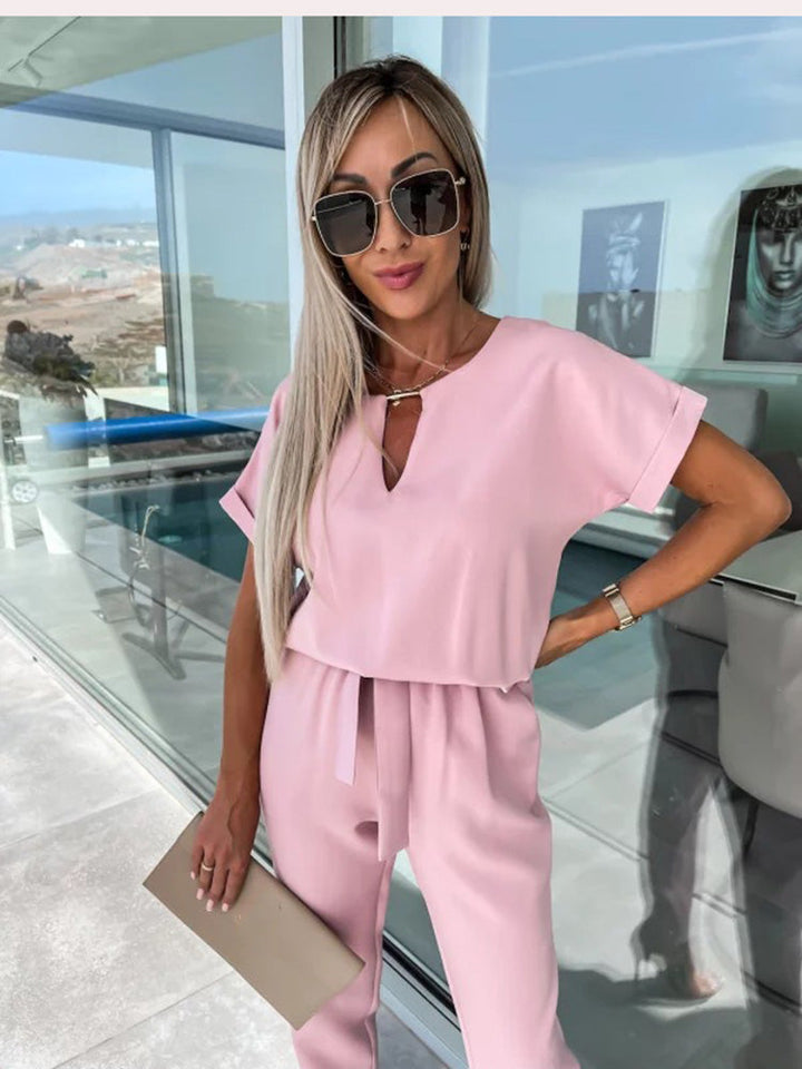 Comfy belted short sleeve jumpsuit for women. Relaxed yet chic, ideal for casual everyday spring outfits.