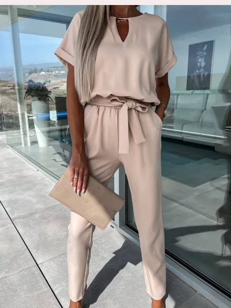 Versatile women's belted jumpsuit with short sleeves. A comfy and chic outfit for any spring or summer occasion.