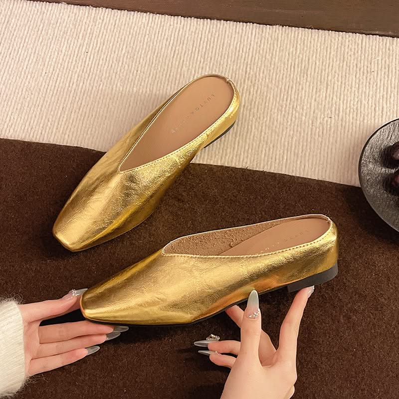 Black women's slip-on flats, versatile for dress or casual wear. Comfortable everyday footwear.