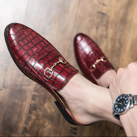 Sophisticated red slip-on mules; elegant women's footwear for versatile summer style.