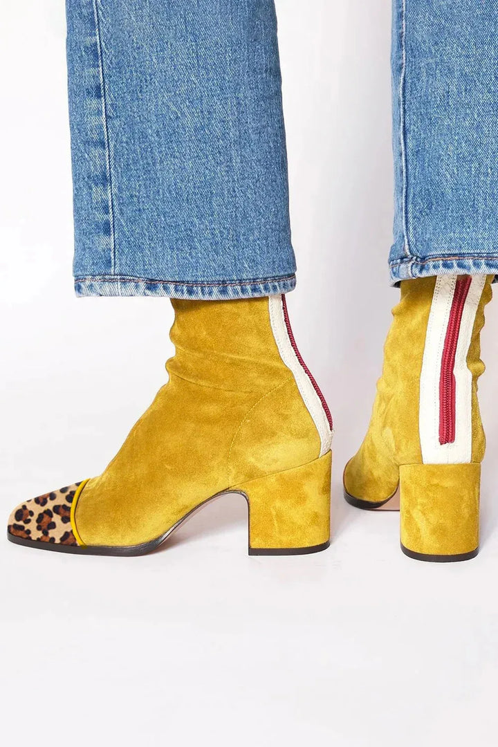 Elegant women's square toe block heel boots. Chic heeled ankle boots for modern fall & winter style.