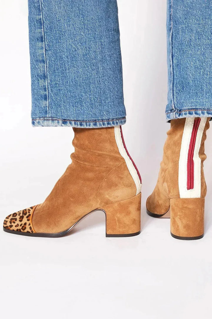 Modern comfort women's square toe ankle boots. Chic heeled boots with a block heel for versatile style.
