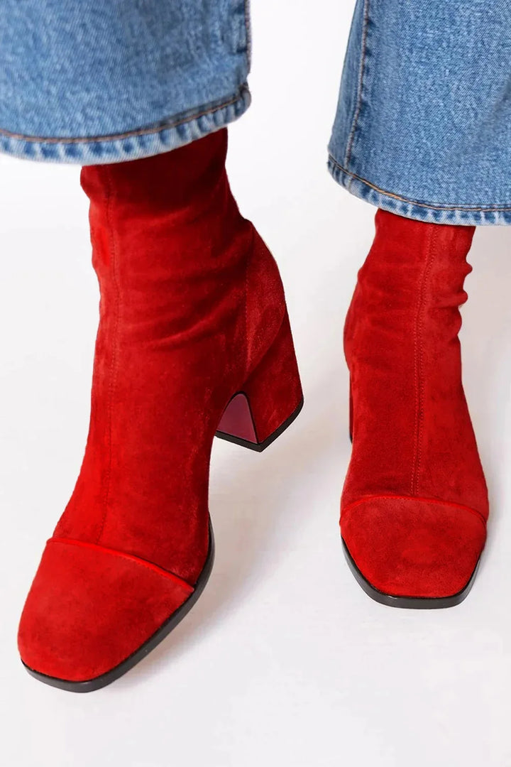 Black women's square toe heeled ankle boots. Stylish block heel for fall and winter fashion footwear.