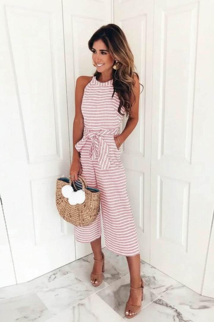 Chic women's striped belted jumpsuit with halter neck, perfect for versatile casual or office wear.
