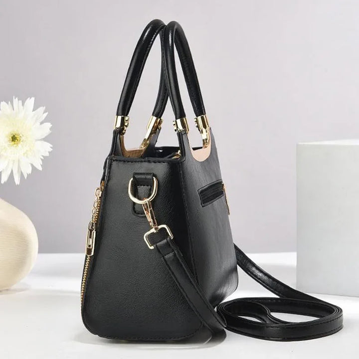 Elegant women's structured shoulder bag. Versatile design, converts to a crossbody bag with detachable strap.