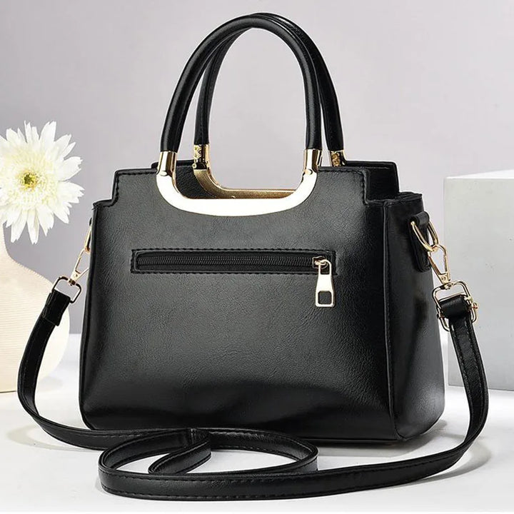 Fashionable women's everyday structured handbag. Faux leather with detachable strap for shoulder or crossbody style.