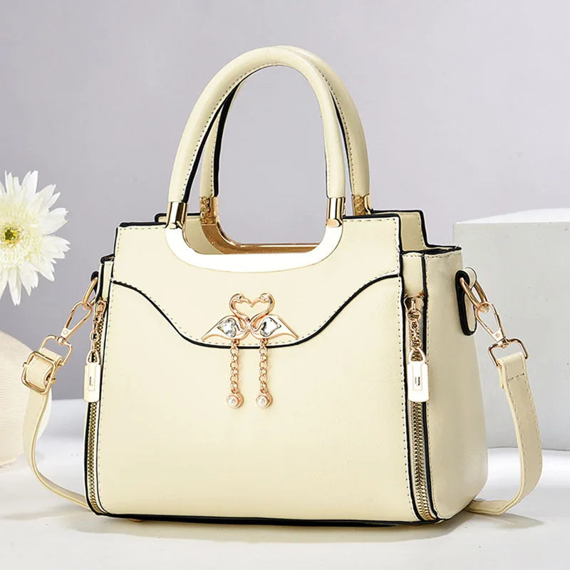 Sophisticated women's structured faux leather handbag. Features a detachable strap for shoulder or crossbody wear.