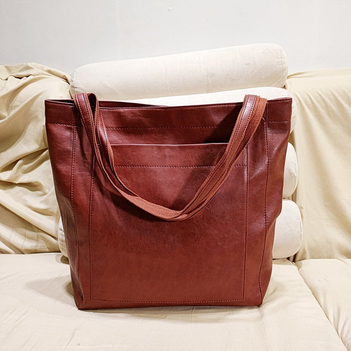 Elegant women's structured tote handbag, a fashionable work bag & everyday accessory with shoulder/crossbody straps.