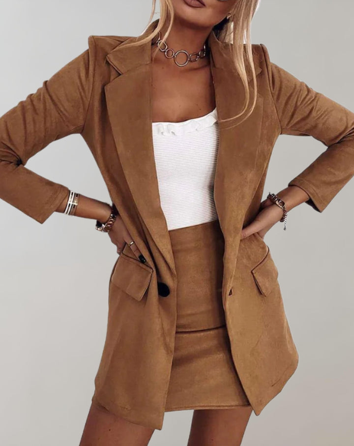 Fashionable women's two-piece tailored blazer & mini skirt set, offering a sophisticated and chic coordinated look.