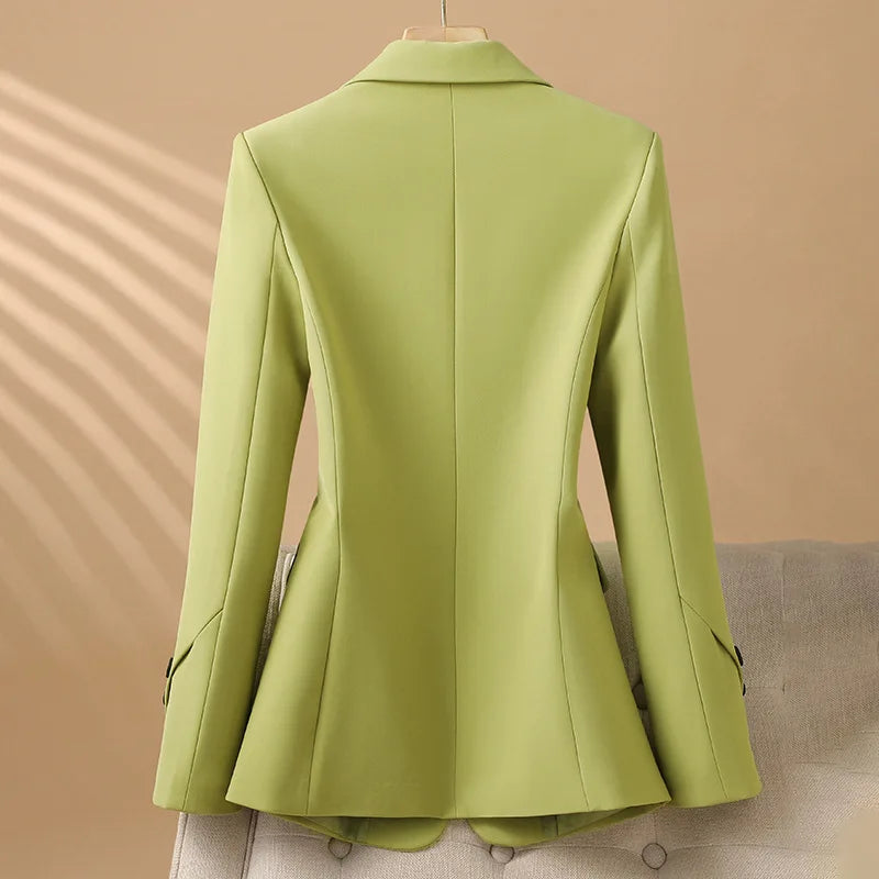 Structured women's tailored blazer with chic contrast buttons. Versatile jacket for professional wear or smart casual elegance.