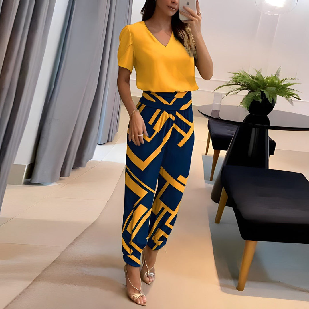 Chic women's two-piece matching set with puff sleeve top & coordinating pants. Perfect for casual everyday wear.