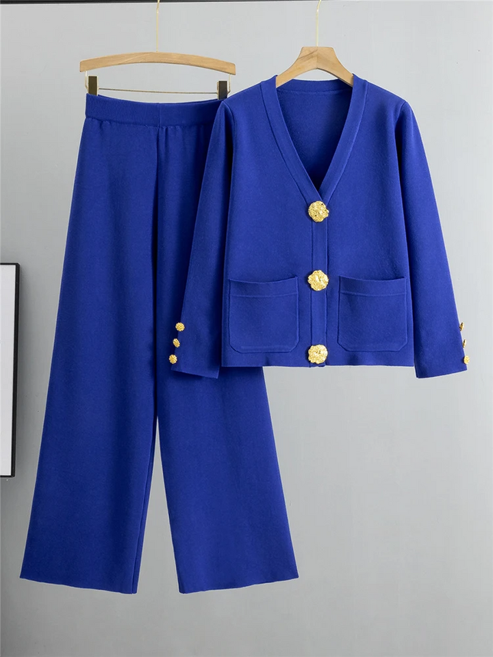 Elegant women's ensemble featuring a gold-trimmed cardigan and matching wide-leg pants. Perfect for chic styling.