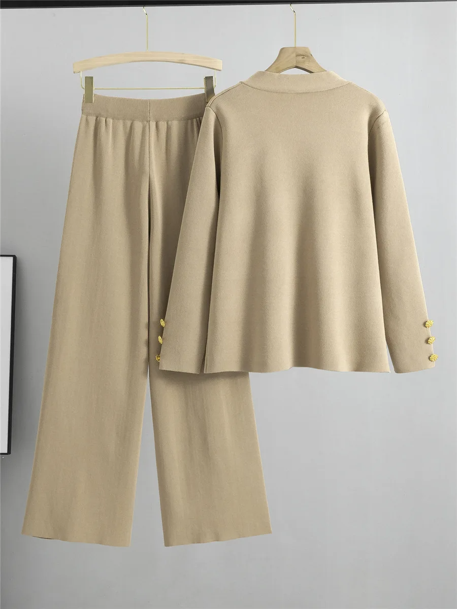Stylish women's gold-accented two-piece set, comprising a top and wide-leg pants. Elevate your elegant wardrobe.