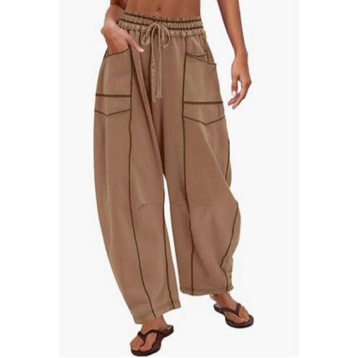 Trendy women's utility cargo barrel pants, blending comfort with a distinctive street style.
