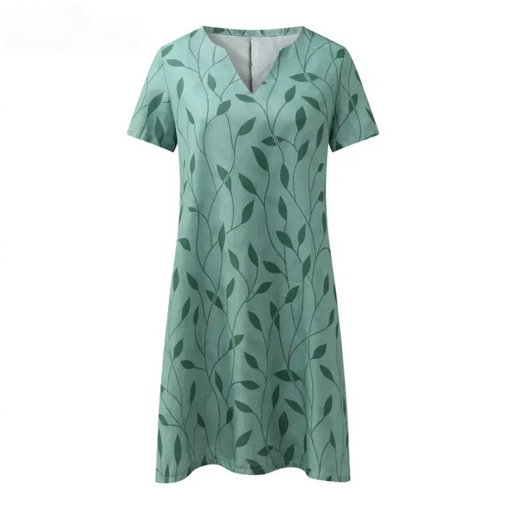 Elegant women's v-neck knit dress. Short sleeves, midi length. A comfortable and chic casual dress for summer fashion.