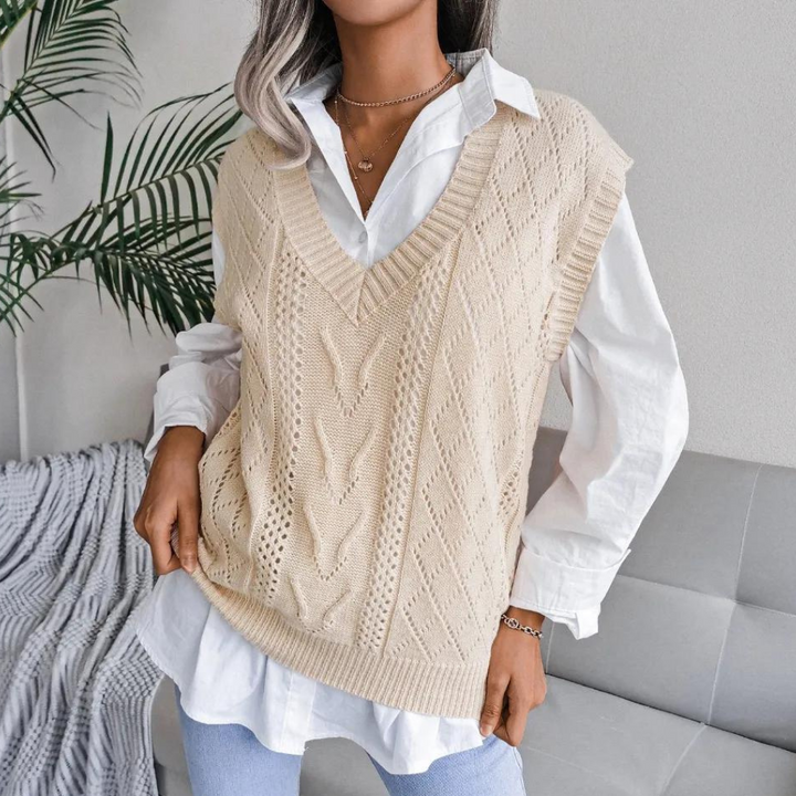 Stylish knit women's V-neck sweater vest. Comfortable, chic layering essential for modern women's apparel.