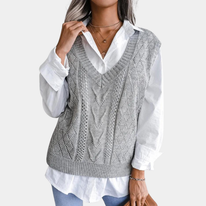 Women's V-neck sweater vest. Chic, comfortable, and versatile sleeveless knit top for modern layering.