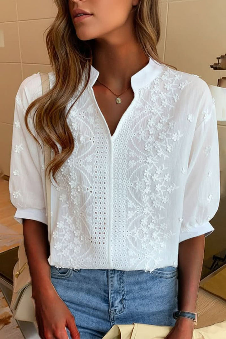 Chic women's V-neck top with short sleeves. Elegant and stylish for everyday wear.