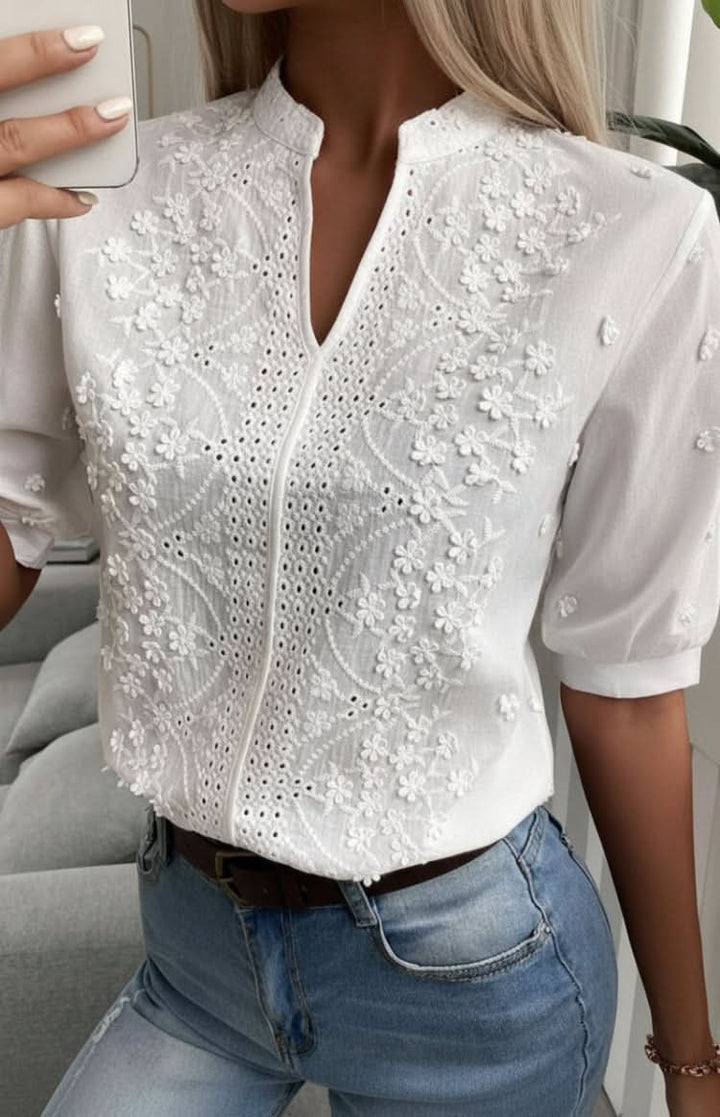 Women's chic V-neck top. Short-sleeve, elegant blouse for versatile everyday, casual, or office fashion.