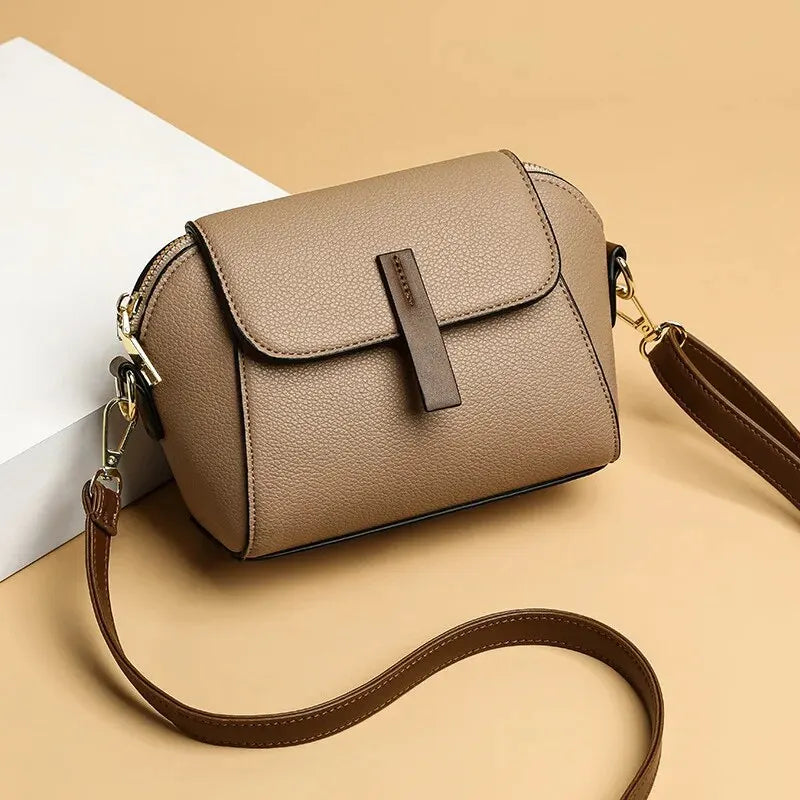 Chic women's vegan leather mini crossbody bag with adjustable strap.