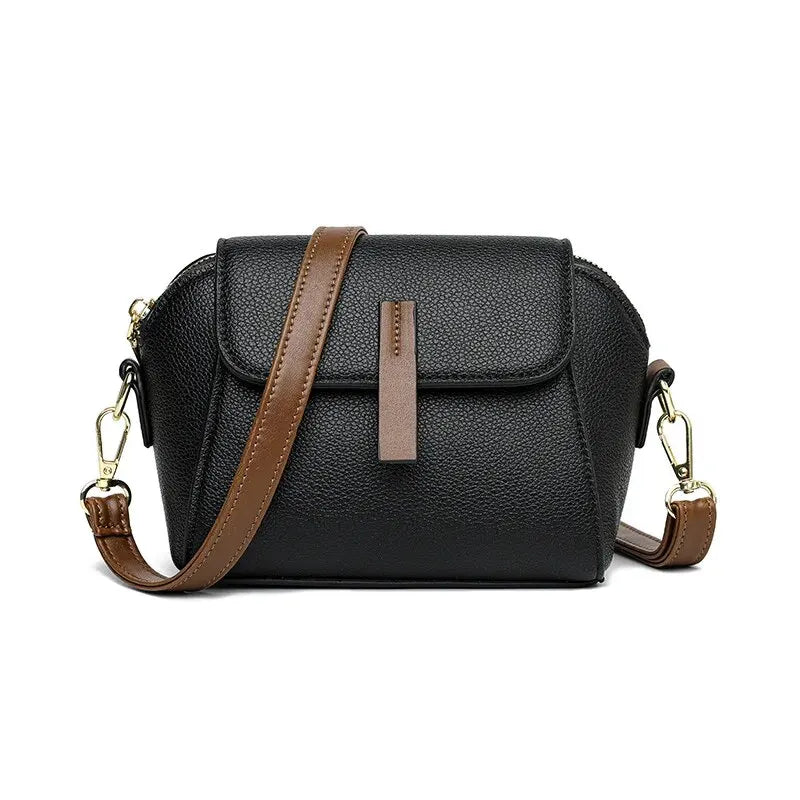 Sleek women's mini bag, a practical vegan leather crossbody with secure flap.