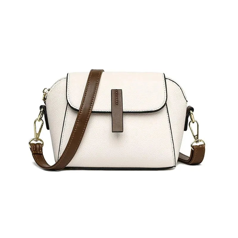 Modern women's faux leather small handbag, ideal for day or evening use.