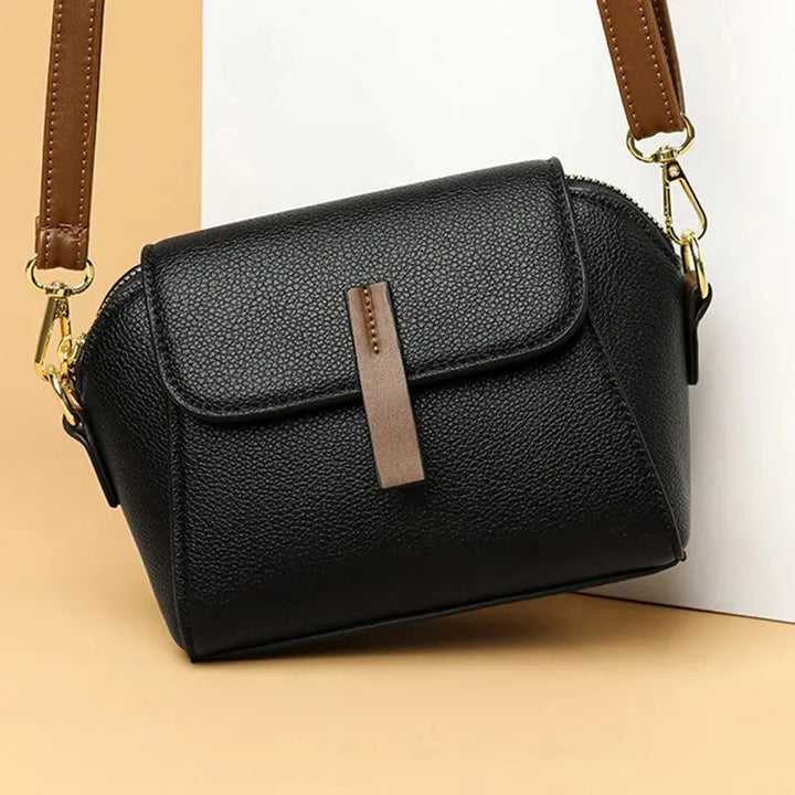 Elegant mini crossbody bag made from high-quality faux leather.