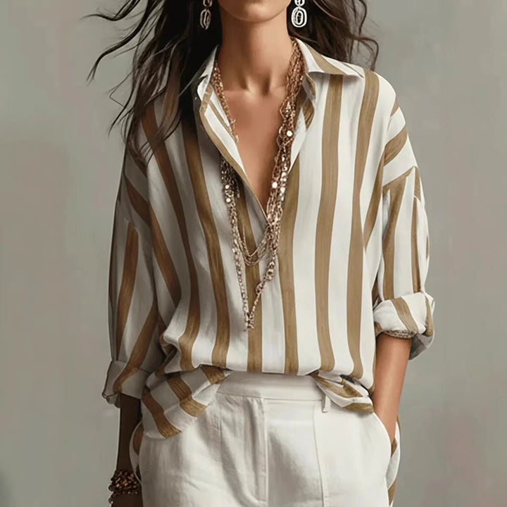 Stylish women's long sleeve vertical stripe shirt. Elegant open collar design for office or casual everyday fashion.