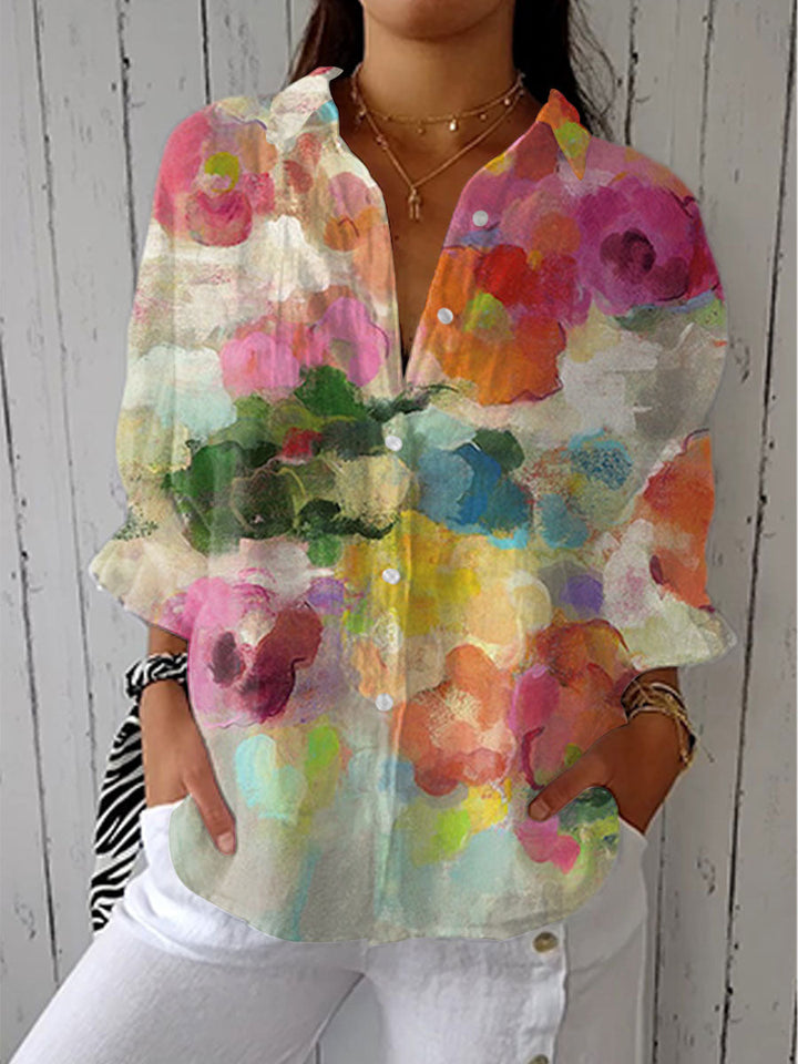 Chic women's vibrant watercolor floral blouse with long sleeves, multicolor artistic print. Perfect for spring/summer.