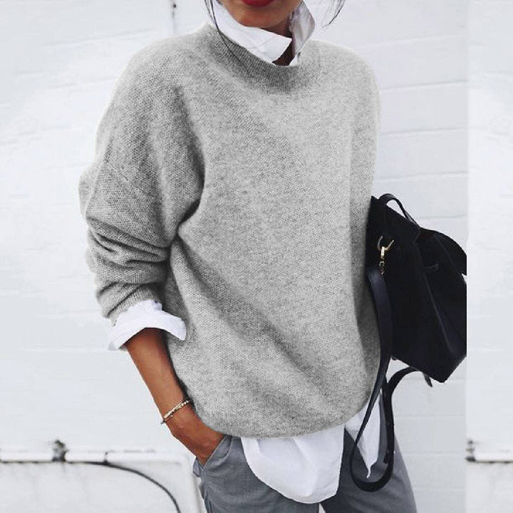 Soft knit women's warm pullover sweater. A cozy, long-sleeve top offering versatile comfort for autumn & winter.