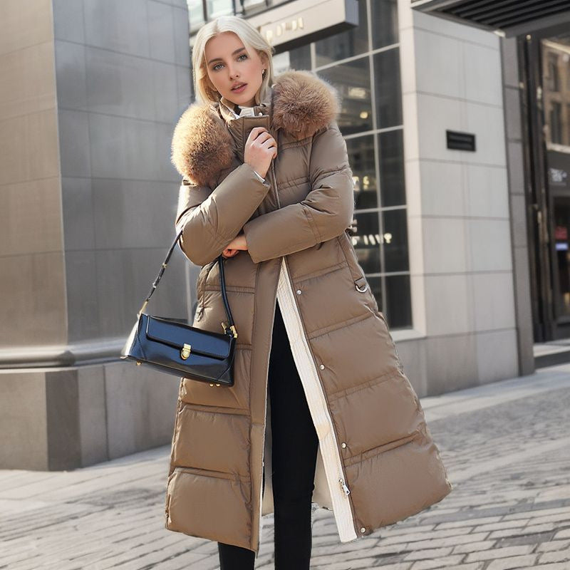 Elegant women's winter fashion: a warm coat featuring a practical removable hood and chic design.