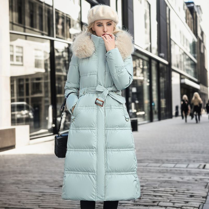 Tailored women's chic winter coat. This elegant outerwear features a convenient removable hood.