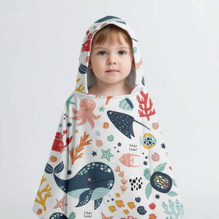 SeaCover children's hooded poncho towel in quick-dry microfiber, all-over sea creatures pattern, soft texture