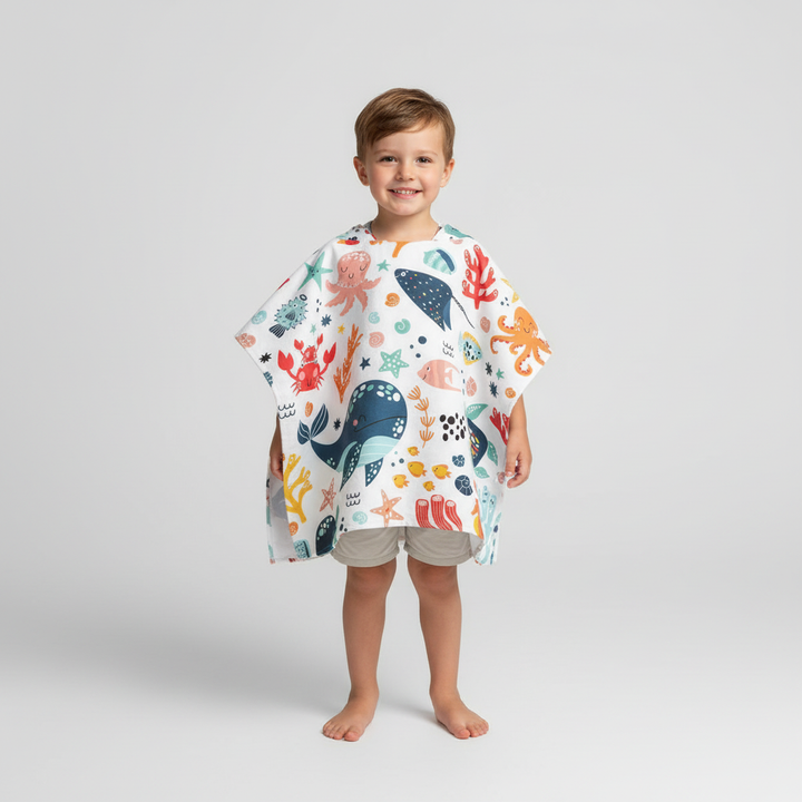 Folded SeaCover children's beach poncho, pink, microfiber, showing compact size for easy packing, fast drying