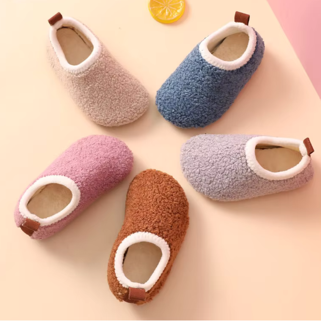 Children's Warm SnuggleSteps slippers, soft non-slip house shoes for cozy indoor comfort.
