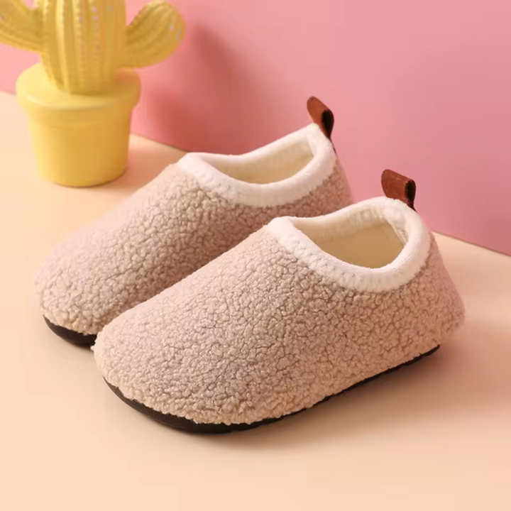 Cozy SnuggleSteps slippers for kids, ultra-soft, warm, & non-slip. Perfect indoor comfort footwear.
