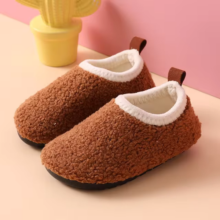 SnuggleSteps warm slippers for children, with a soft, plush lining & secure non-slip bottom.