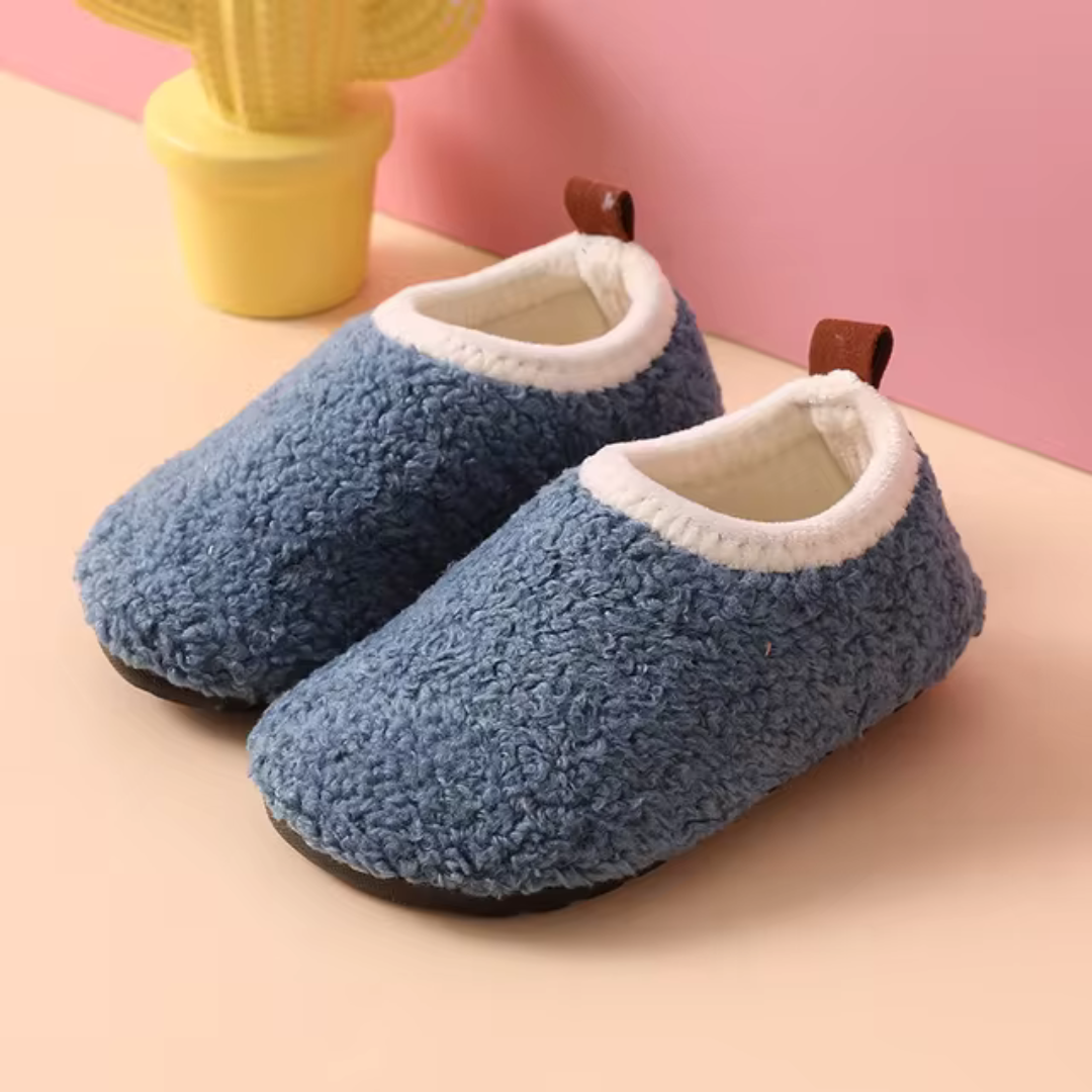Soft SnuggleSteps kids' house shoes, providing warmth & non-slip safety for little feet at home.