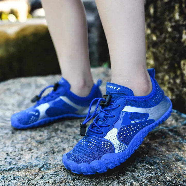 Children's WaveTrek beach shoes, protective fixed sole & secure fit for water play. Quick-dry kids aqua footwear.