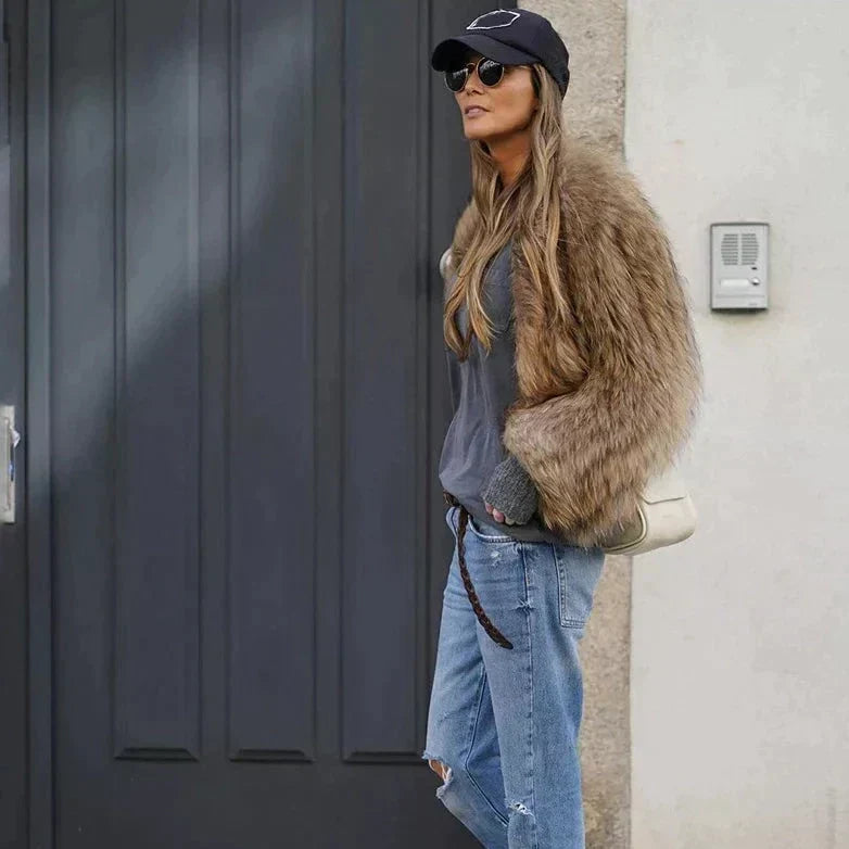 Cozy Clarisse women's long plush fur coat. Luxury winter jacket for an elegant fashion statement.