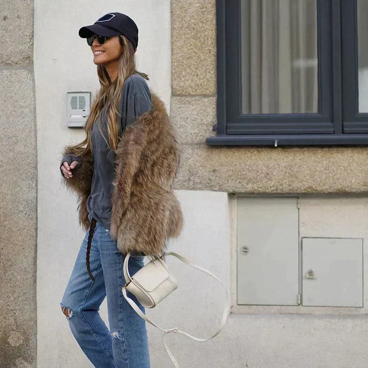 Luxurious plush fur Clarisse women's coat. Warm, elegant winter outerwear, perfect for cold weather style.