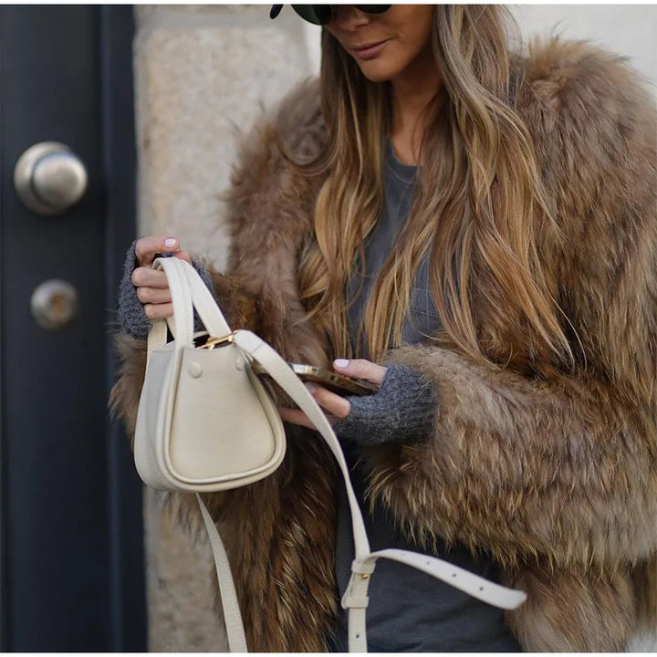 Statement Clarisse women's plush fur coat. Premium luxury winter outerwear for warmth & elegant style.