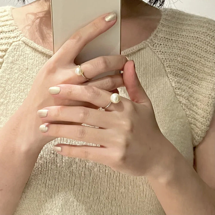 Beautiful women's classic adjustable pearl ring with freshwater pearl detail on silver ring.