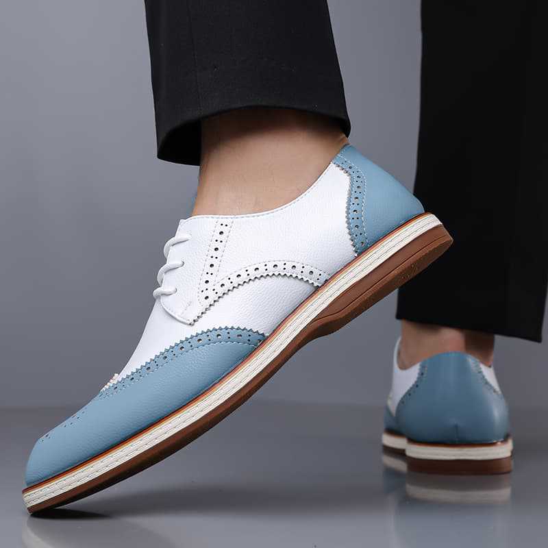 Men's brogue dress shoes paired with a suit. Sharp formal footwear for a professional office look.